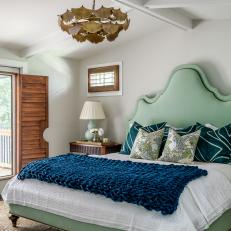 Neutral Transitional Bedroom With Unique Seashell Light Fixture