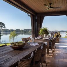 Covered Patio With Two Outdoor Dining Areas and Waterfront Views