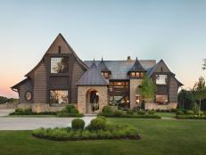 Front of Stone-and-Wood House With Minimal Landscaping