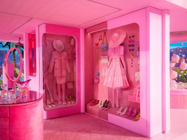 Pink two-sided closet with suit set and gingham dress. 