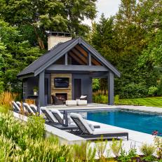 Modern Black Pool House With Fireplace