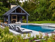 Modern Backyard With Lush Greenery and Sleek Pool House 