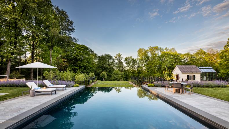 idyllic backyard with pool and vegetable garden