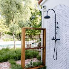 White Outdoor Shower In Spanish-Inspired Backyard