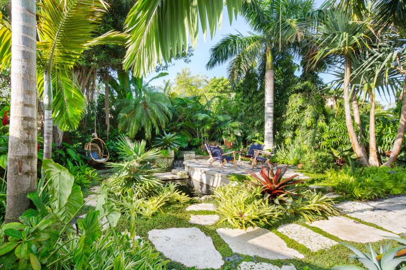 private oasis with vegetation, water features and patios