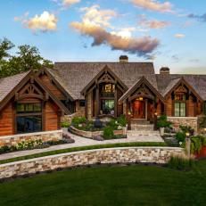 Large Cabin With Rustic Wood Siding and Inviting Lawn