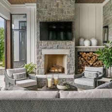 Covered Patio With Fireplace and Mounted TV