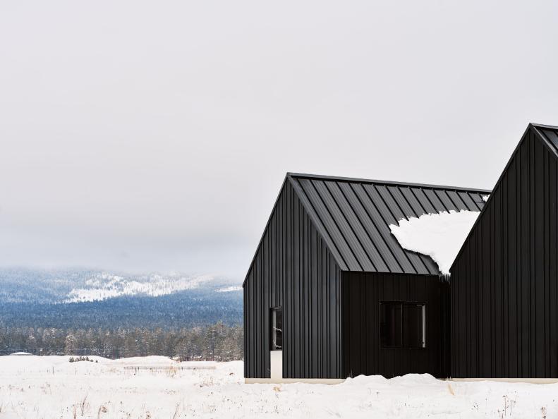 Black Farmhouse in Snow