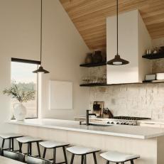 Neutral Open Plan Kitchen With Limestone Backsplash
