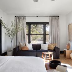 Modern Black and White Bedroom With Hardwood Floors