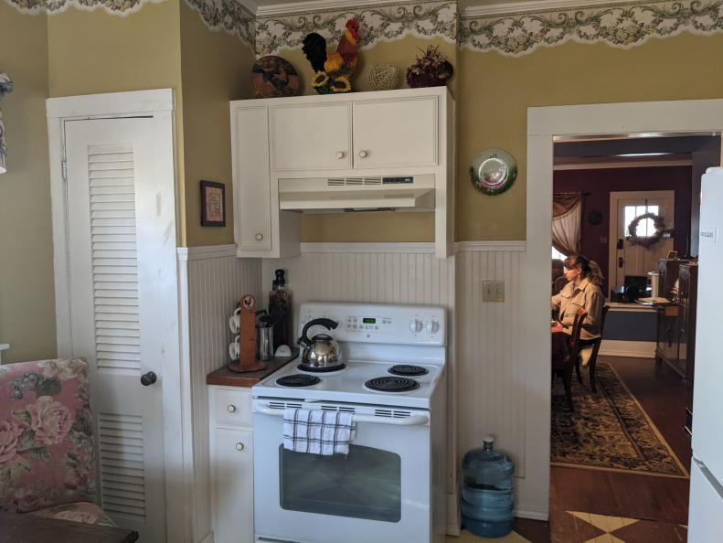 Before the renovation, the kitchen featured dated cabinets and appliances.