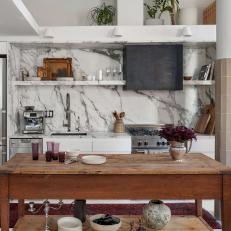 White Contemporary Kitchen With Marble Backsplash and Wood Island