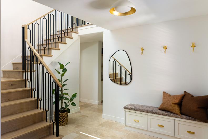 Foyer With Bench and Stairs