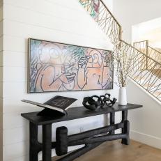 Artwork Adds Color to White Transitional Stair Landing Nook
