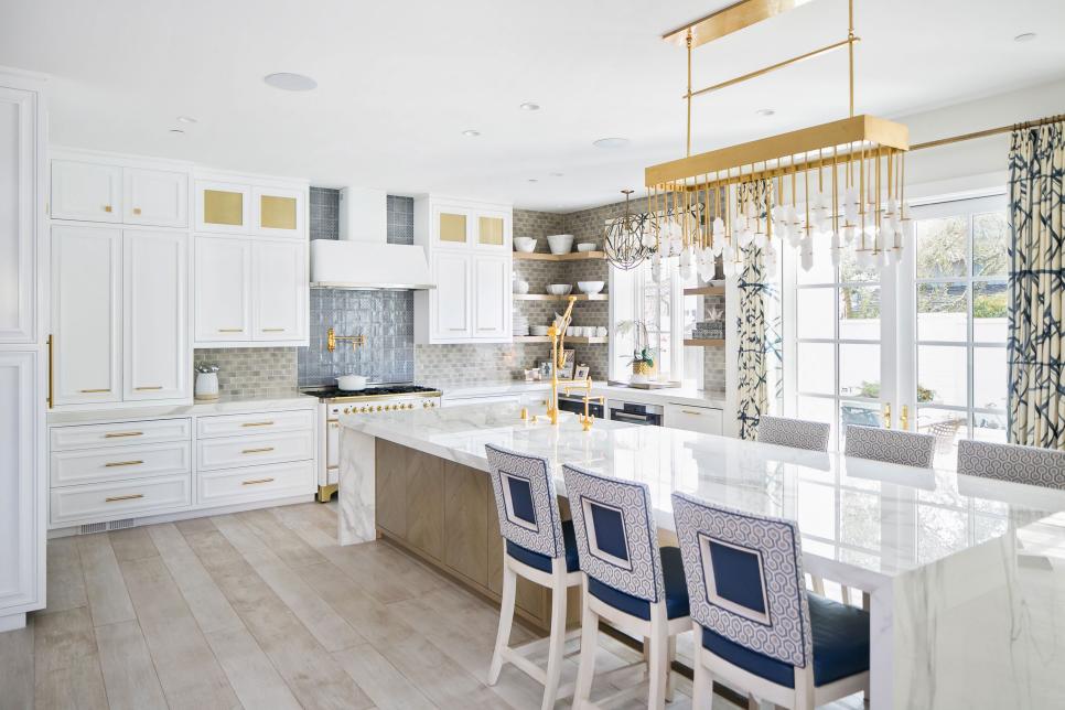 Kitchen Island With White Marble Waterfall Counter and Barstools