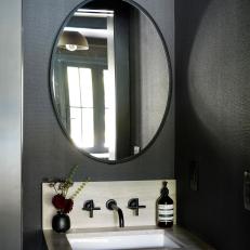 Large Oval Mirror Above Sink in Black Contemporary Powder Room