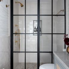 Black-Framed Glass Shower Doors in Neutral Transitional Bathroom