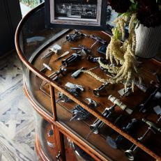 Wood-and-Glass Cabinet Displays Antique Corkscrews