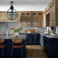 Metal-and-Glass Light Above Island in Neutral Transitional Kitchen