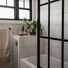 Neutral Contemporary Bathroom With Black-Framed Glass Shower Door