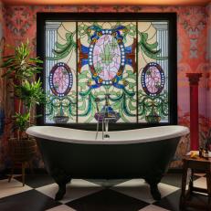Tub Centered in Front of Stained-Glass Window in Colorful Transitional Bathroom