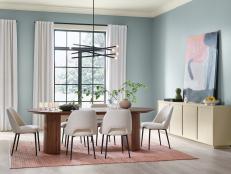 Chic, Pale Blue Dining Space With Modern Furniture and Decor