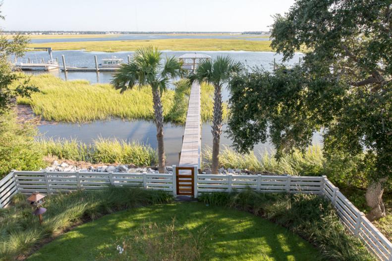 View overlooking a lush backyard and Intracoastal Waterway 