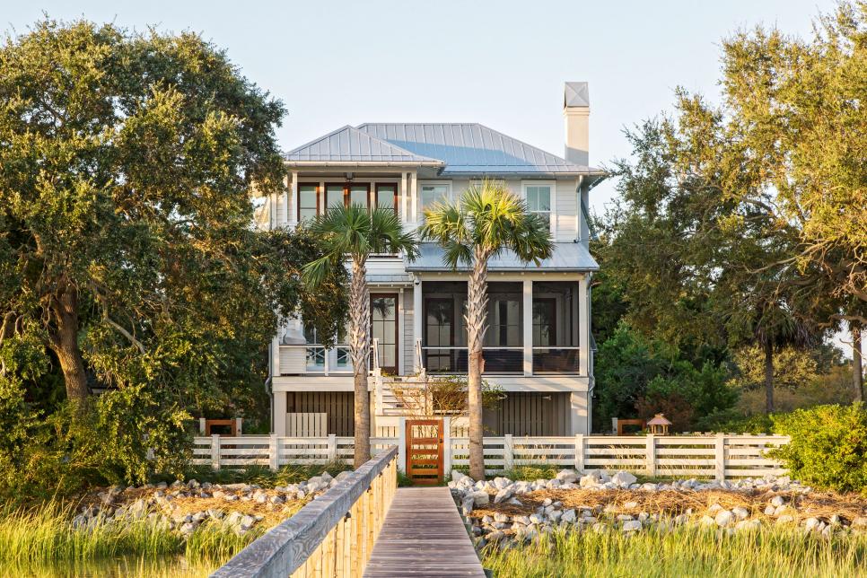 Rear view of an elevated Lowcountry home with mahogany wood accents