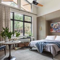 Tan Contemporary Bedroom With Colorful Art