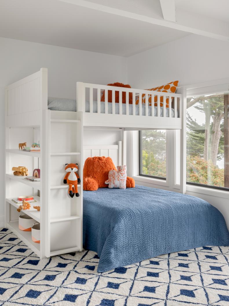 White Bunk Room With Blue and Orange Decor