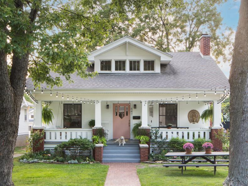 White Craftsman-Style Home With a Pink Door