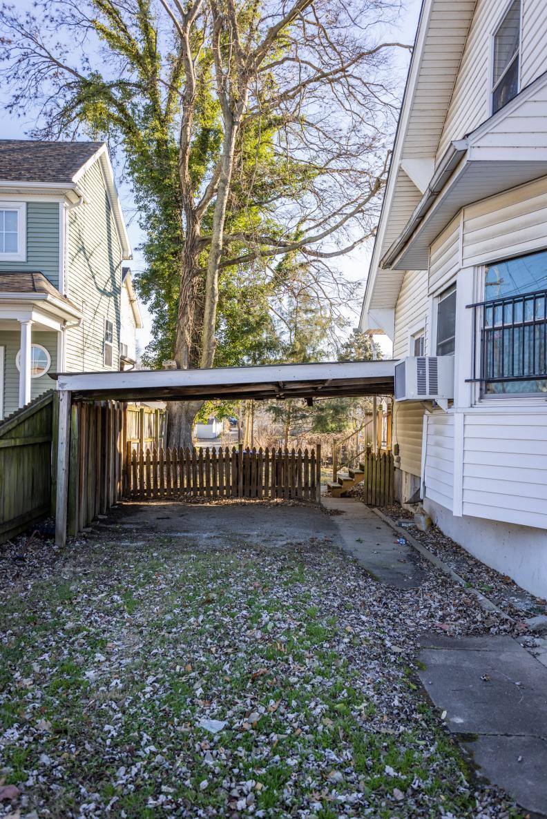 Before images of the front exterior of the house as seen on HGTV's Urban Oasis 2023 Giveaway Home located in Kentucky.