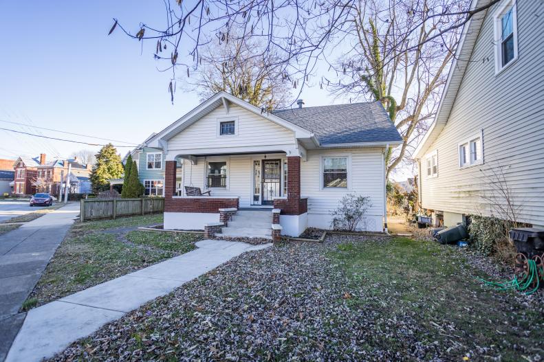 Before images of the front exterior of the house as seen on HGTV's Urban Oasis 2023 Giveaway Home located in Kentucky.