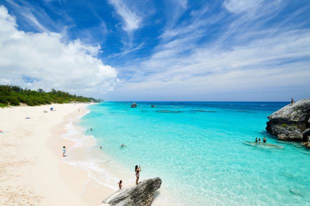 People on the beach and in the water of Warwick Bay, Southshore Beach, Bermuda