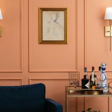 Picture-frame Molding With Wall Sconces and Framed Art