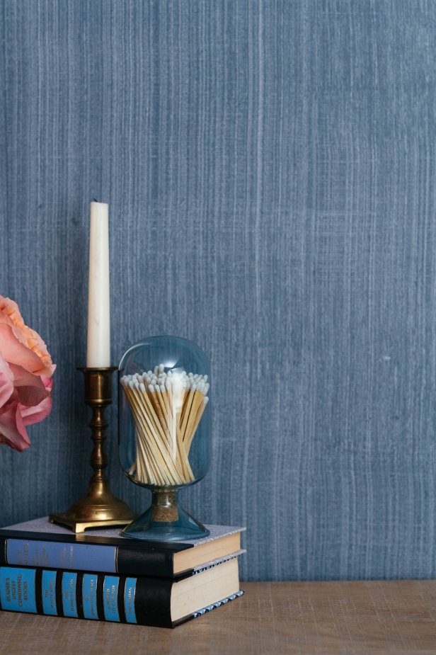 A simple paint-and-brush technique can create the timeless look of grass-cloth wall treatment — at a fraction of the cost.  Color coordinated accessories complement the look.