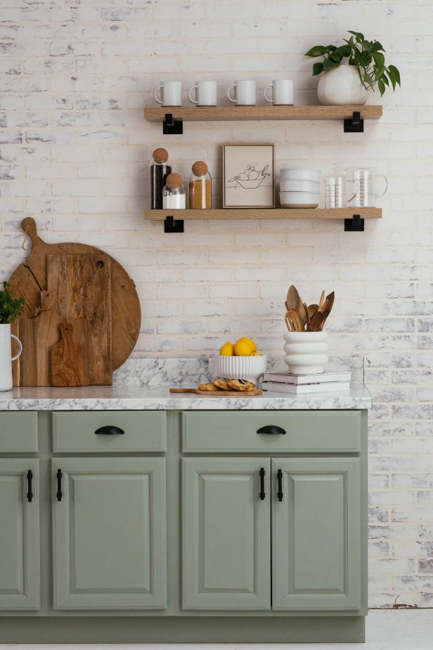 This faux brick kitchen backsplash gets a 'German schmear' treatment (sometimes called a mortar wash), creating the classic, patinaed look that's characteristic of the home-exterior masonry technique.