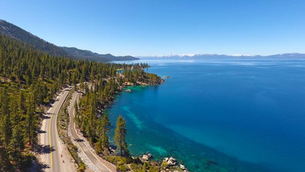 A view of Lake Tahoe with mountains in the background from the drive along the Lake Tahoe Loop.