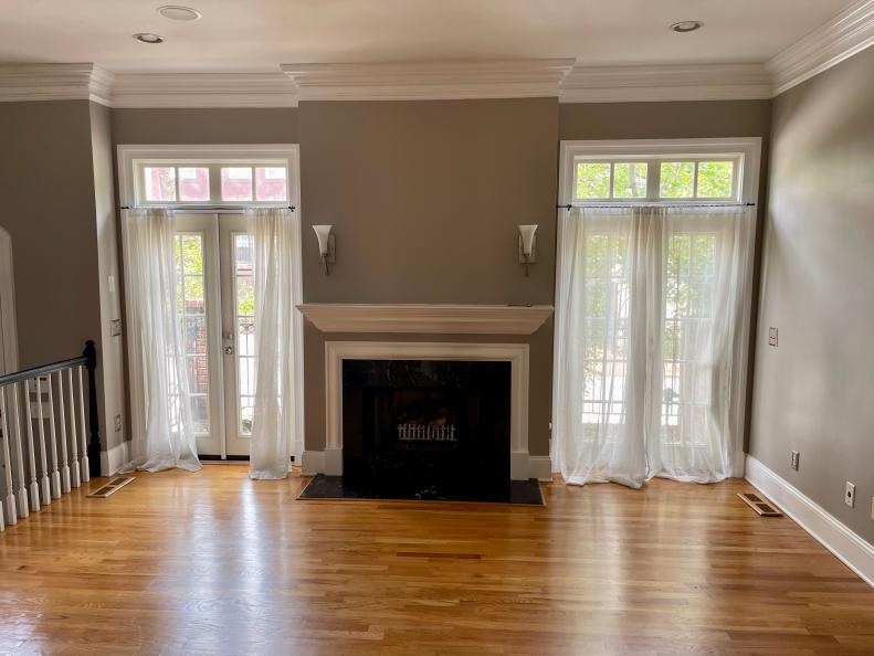 Dated Living Room with Dark Fireplace, Sheer Curtains on French Doors