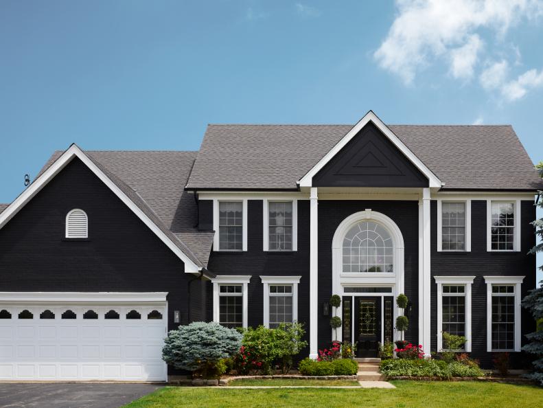 Expansive Black and White Home Exterior With Columns