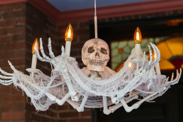 Chandelier made of bones and a skull draped with cheesecloth