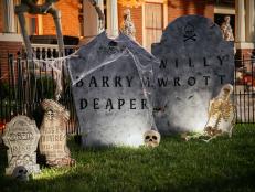 Craft a giant tombstone for your front yard Halloween decor with a few inexpensive materials.