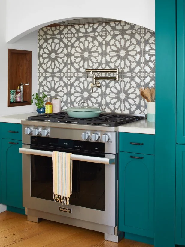 Stove Area With a Patterned Backsplash in a Spanish-Style Kitchen