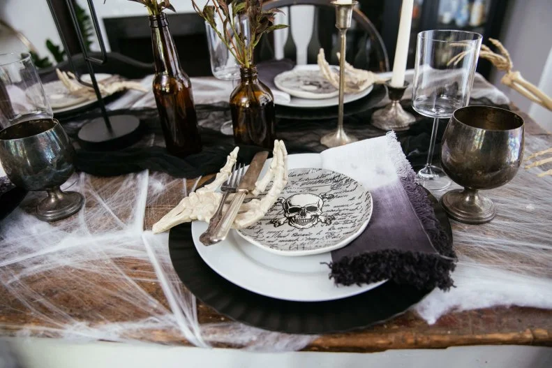Halloween place setting with skull plate, ombre napkin and skeleton