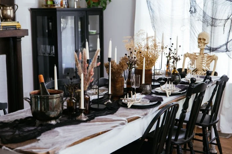 Halloween tablescape featuring natural elements and neutral decor