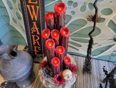 Learn how to inexpensively make a haunted-house-worthy spooky candelabra using pool noodles, battery operated candles and a few basic craft supplies.