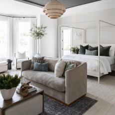 Neutral Transitional Bedroom With Beige Loveseat