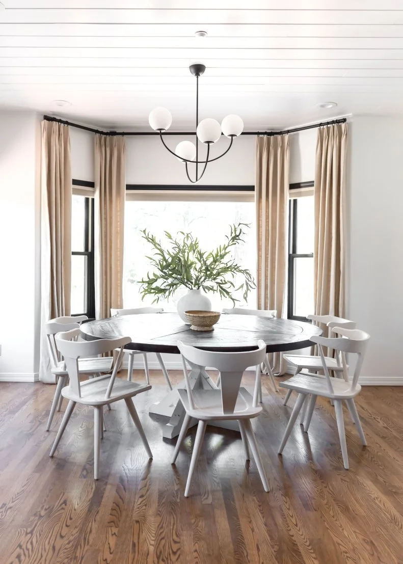 White Dining Room With Beige Curtains