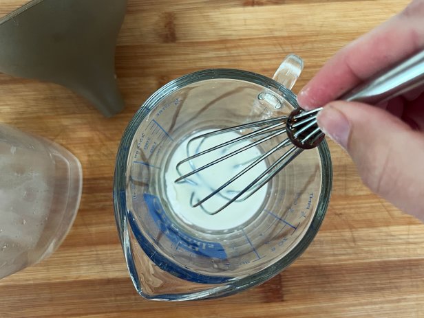 Whisk cornstarch in water to remove clumps in a diy glass cleaner