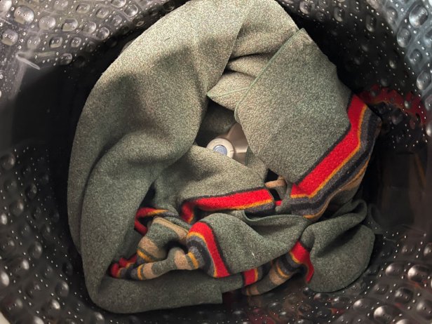 A wool Pendleton blanket in the washing machine.